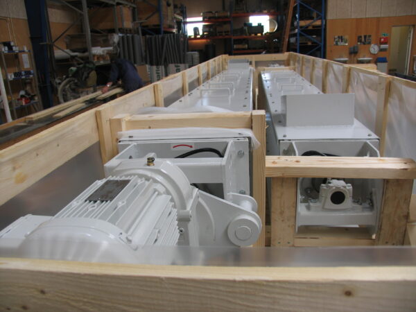 Horizontal screw conveyors packed and ready for shipping